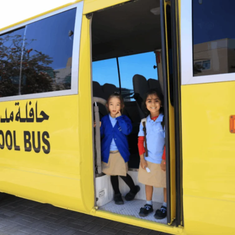 Students boarding a school bus at Star International School Mirdif