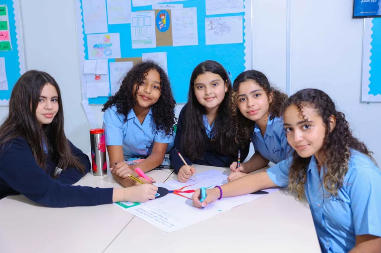 Students collaborating on a group classroom activity at Star International School Mirdif